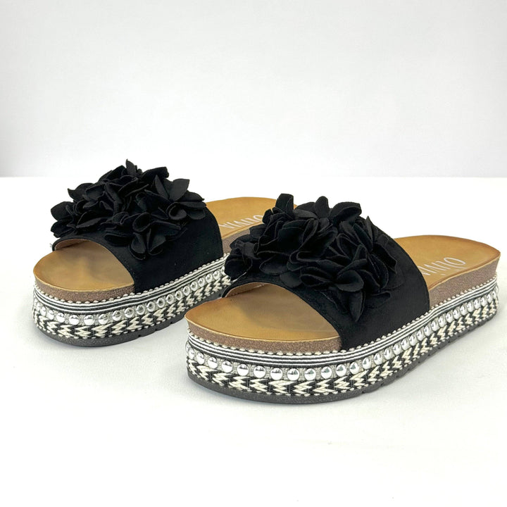 Emma & Rose Cape Town Platform™ slippers with ruffles, stylish slip-on shoes featuring a comfortable design and decorative ruffle details.