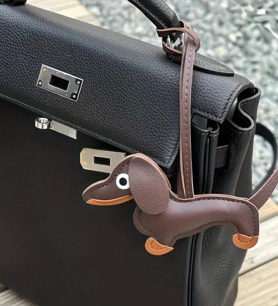 Dachshund-shaped bag charm in pink and black with Emma & Rose Cape Town branding, featuring detailed plush design.