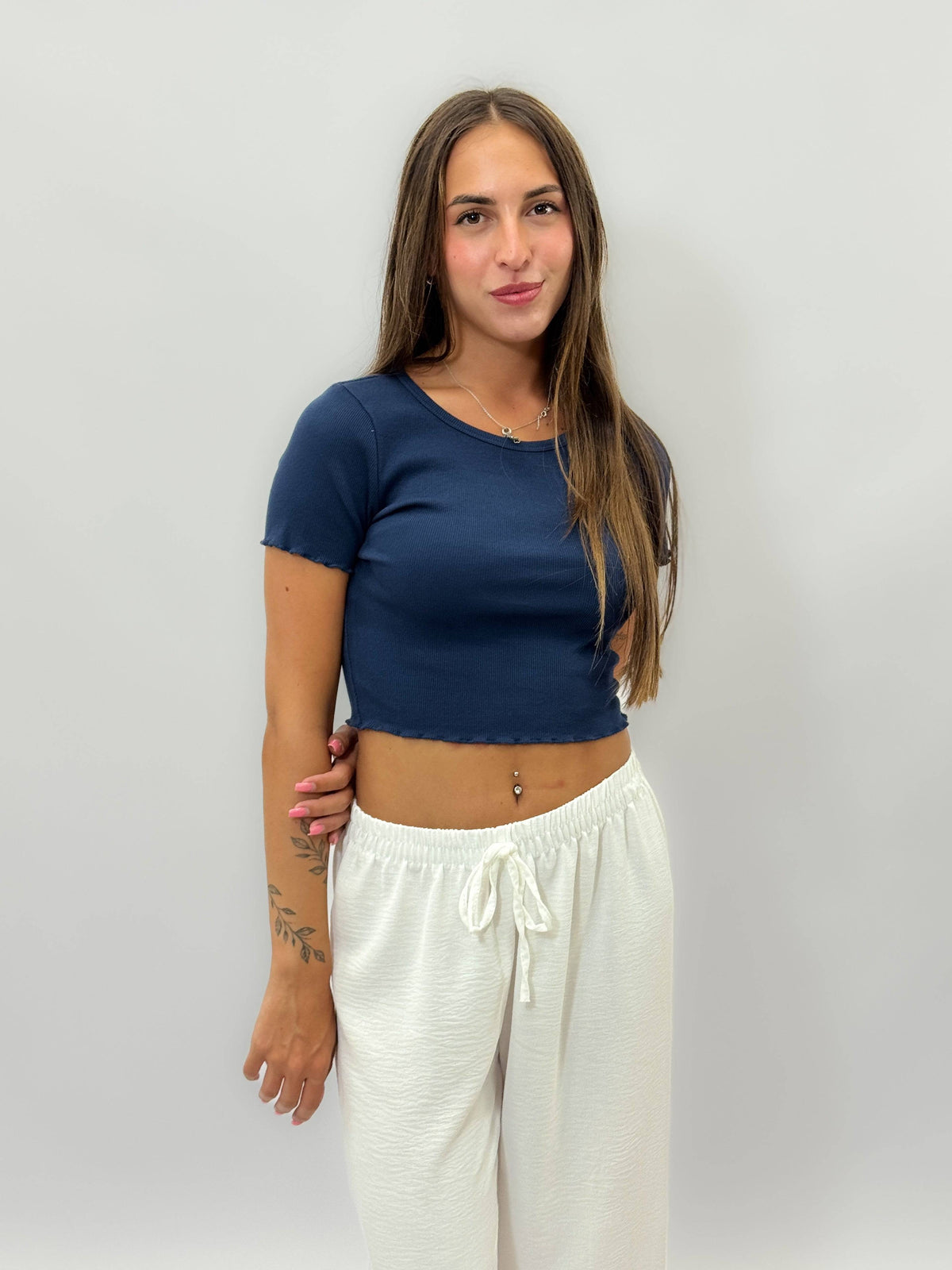 Petite™ ribbed T-shirt by Emma & Rose Cape Town, close-up of soft, fitted maglieria knit fabric in a neutral color.