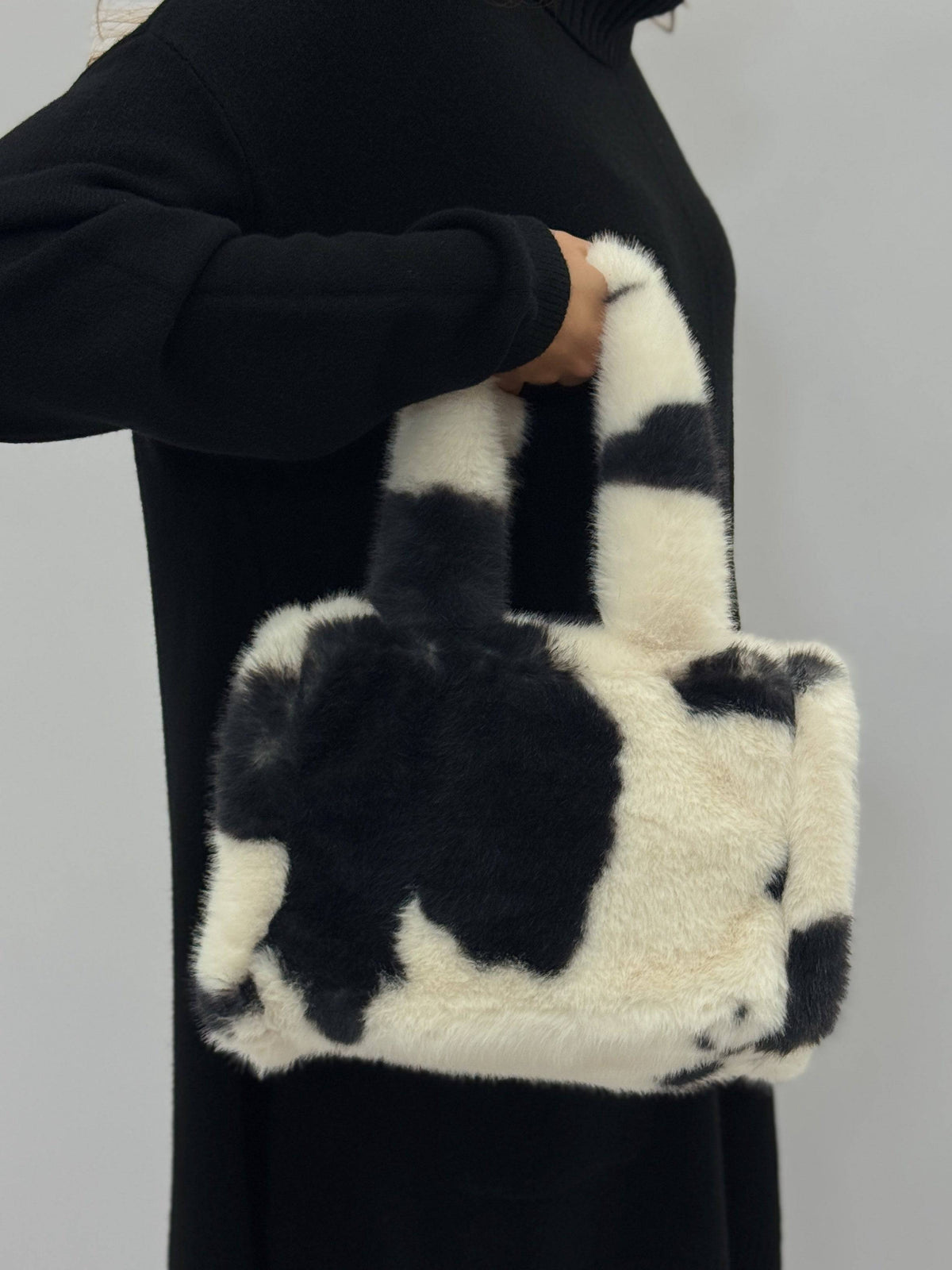 Emma & Rose Cape Town Talita faux fur leopard handle bag with stylish design and textured fur detail.