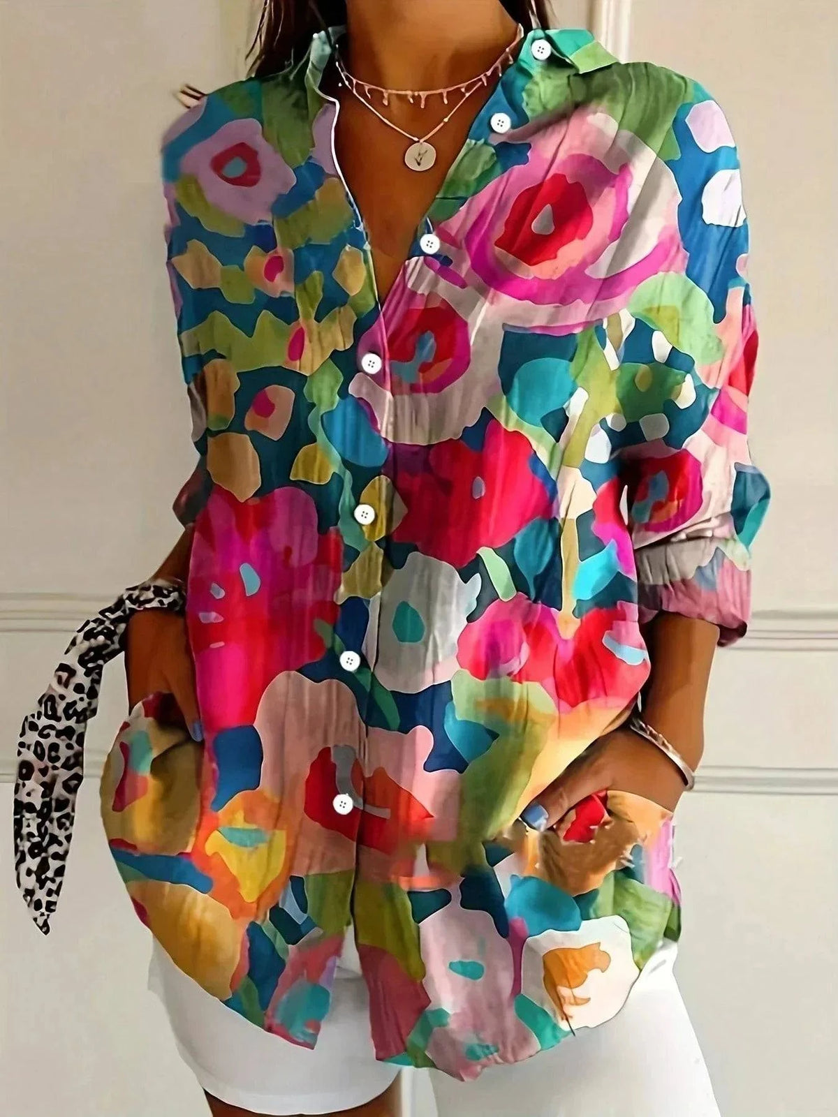 Astrid™ colorful patterned blouse by Emma & Rose Durban, featuring vibrant floral and geometric designs, worn on a model.