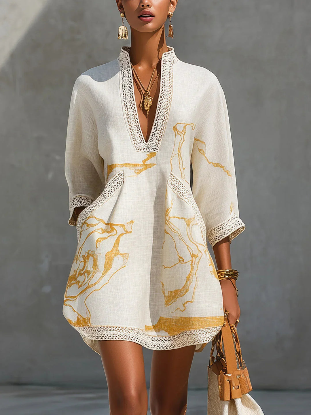 Donatella - Black mini dress with golden marble print and crochet lace