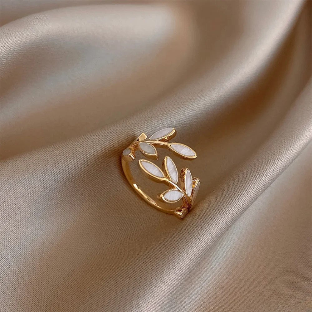 Adjustable gold leaf ring by Emma & Rose Cape Town featuring delicate leaf design on a sleek gold band